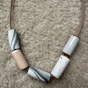 Like new pursuits of happiness clay bead necklace blush marble leather cord